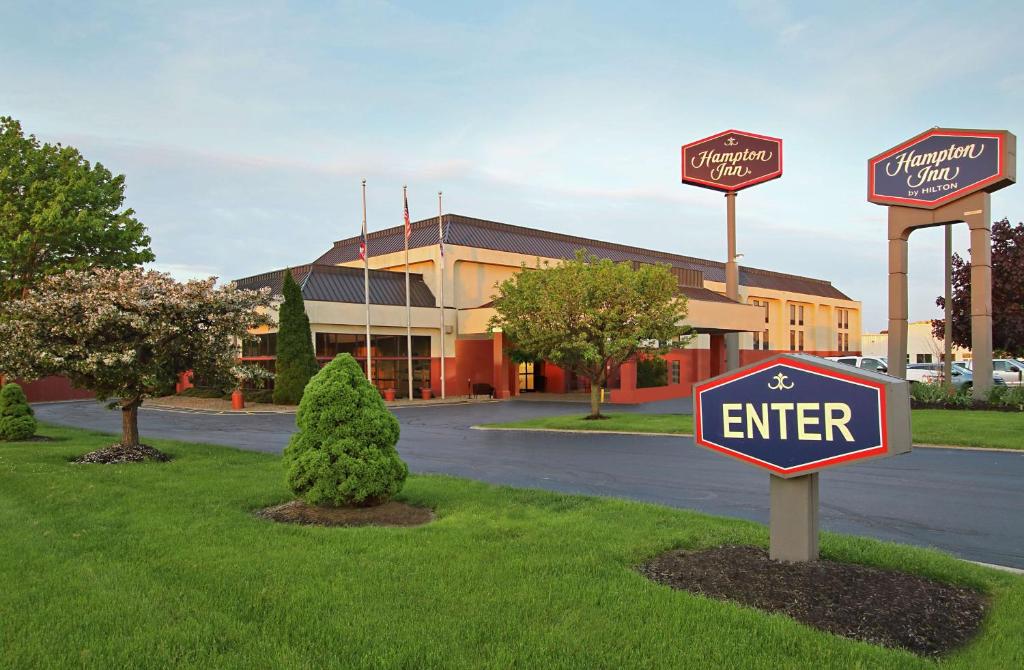 a sign that says enter in front of a building at Hampton Inn Ashtabula in Austinburg