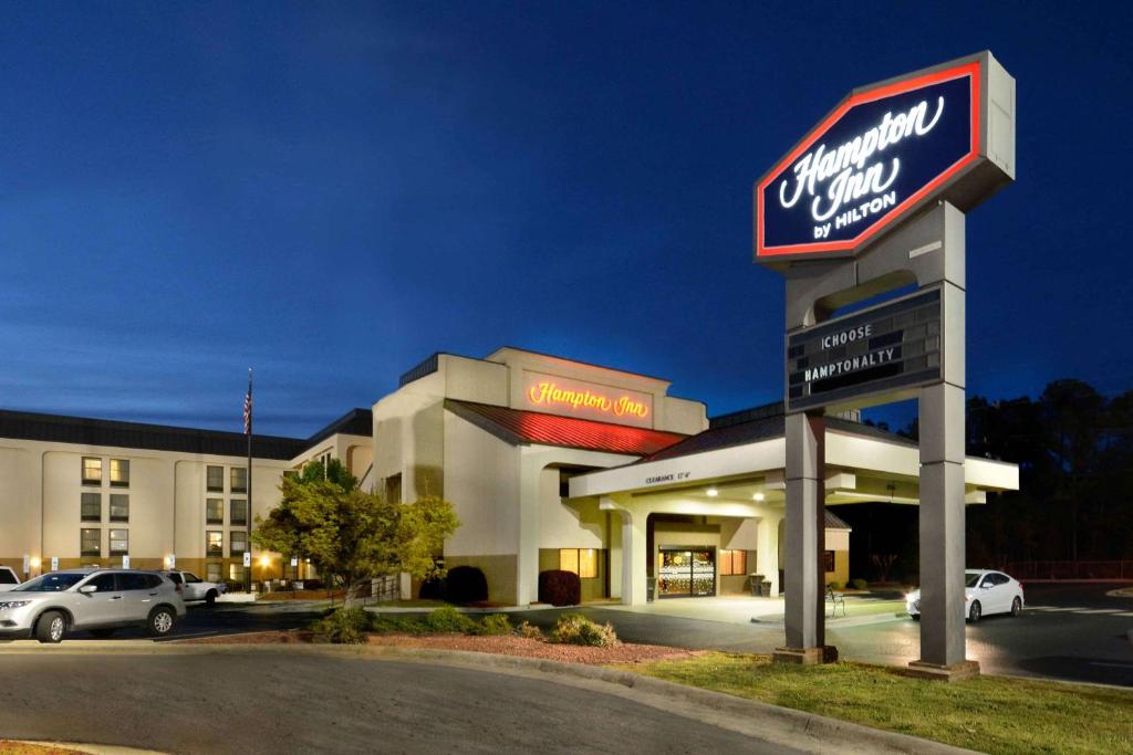 a mobil gas station with a sign in a parking lot at Hampton Inn Fayetteville Fort Liberty in Fayetteville