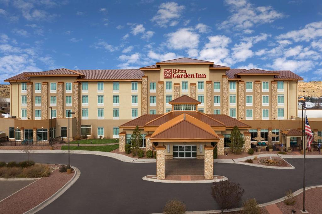 a rendering of a hotel with a sign on it at Hilton Garden Inn Gallup in Gallup