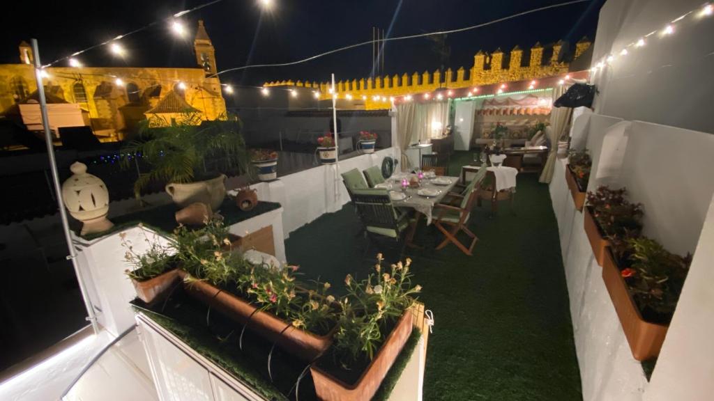 an overhead view of a patio with tables and plants at Apartamento con Terraza,a 100m playa Costilla y Frente al Castillo in Rota