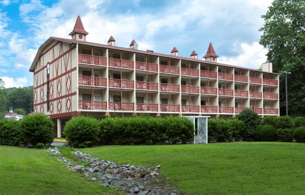 a large building with red balconies on top of it at Hampton Inn Helen in Helen