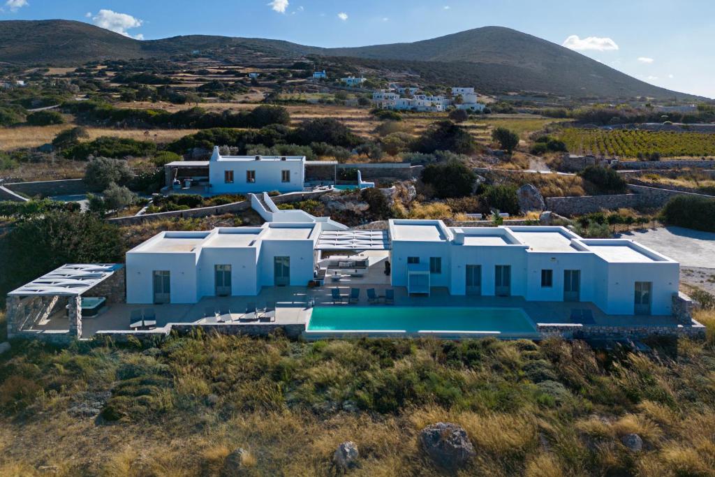 an aerial view of a villa with mountains in the background at Angels Estate Precious Villas in Naousa