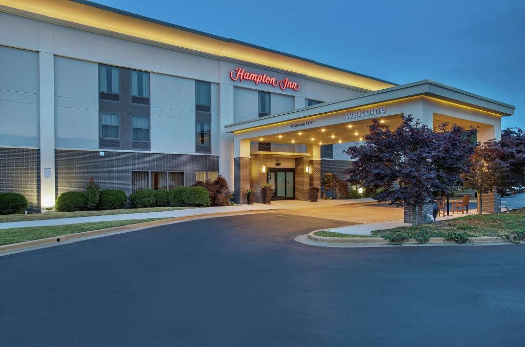 a hotel building with a sign that reads chiropractor clinic at Hampton Inn Cullman in Cullman