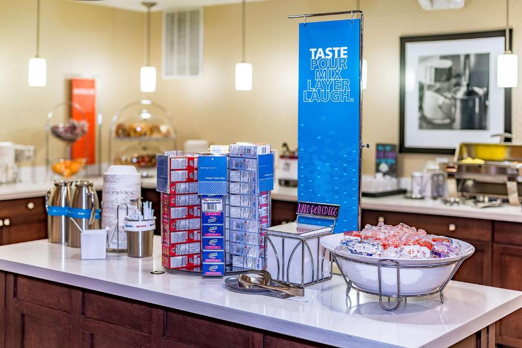 a counter with a bunch of products on it at Hampton Inn Niagara Falls/ Blvd in Niagara Falls