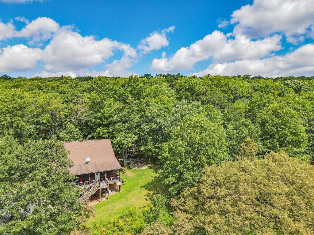 an overhead view of a house in the middle of a forest at Modern Cabin with Hot Tub and Fire Pit in Swanton