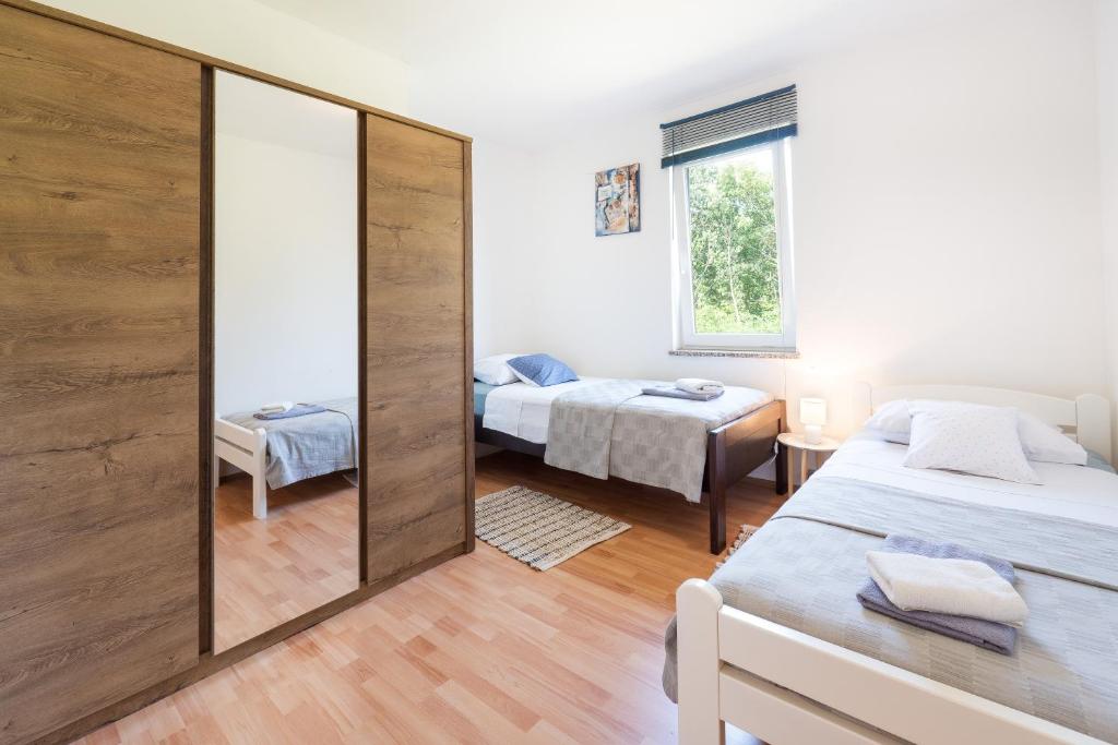 Postel nebo postele na pokoji v ubytování Apartman 6 + 2