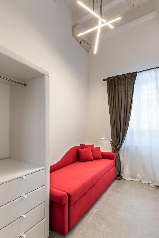 A bed or beds in a room at Casa Massima Suites & SPA