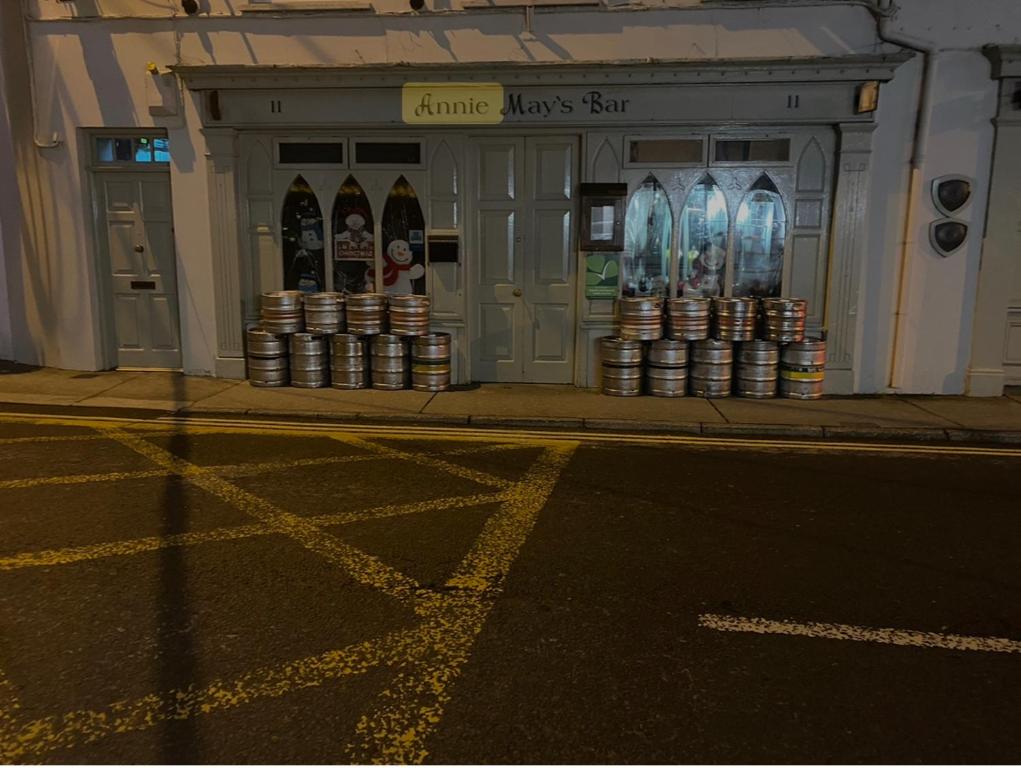 a store on the side of a street withbeer cans at Annie May's Bar, B&B in Skibbereen