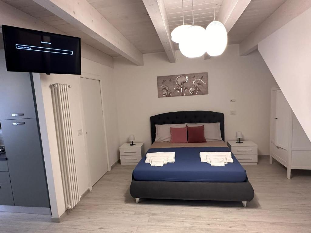Postel nebo postele na pokoji v ubytování B&B La Fortezza