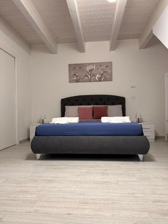 Postel nebo postele na pokoji v ubytování B&B La Fortezza
