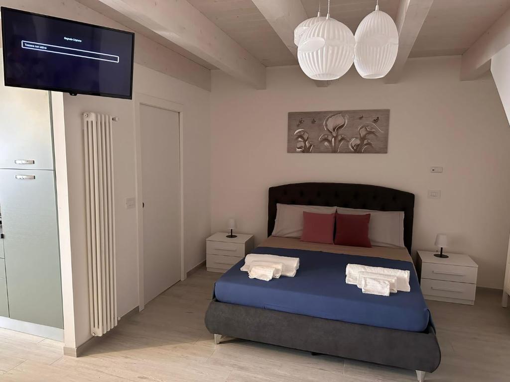 Postel nebo postele na pokoji v ubytování B&B La Fortezza