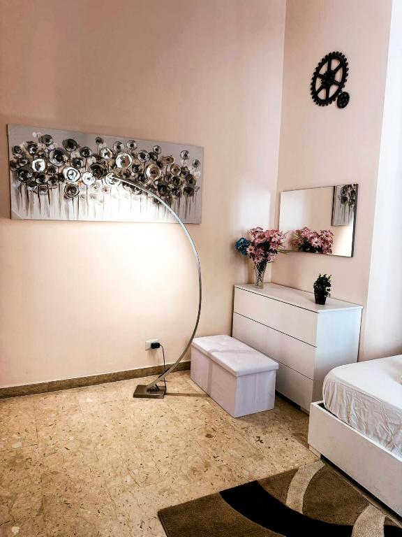 a bedroom with a mirror and a bed and a table at Sina Rent Room in Rome