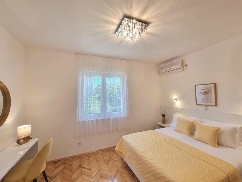 Postel nebo postele na pokoji v ubytování Apartmani Milin