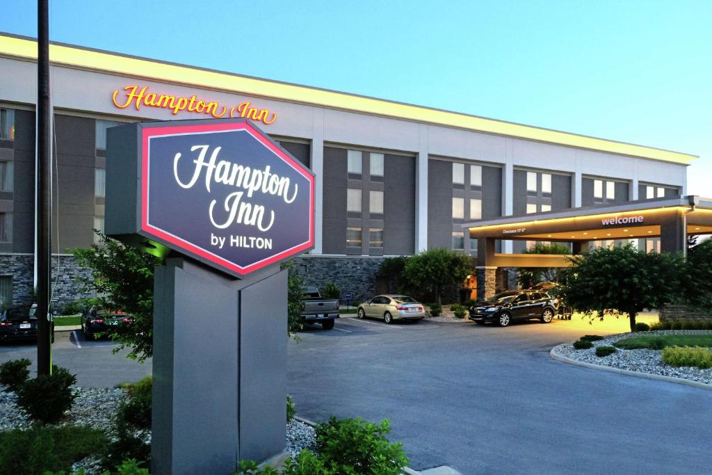 a hampton inn sign in front of a building at Hampton Inn Lima in Lima