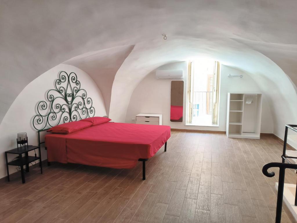 En eller flere senge i et værelse på La Volta di Gatto