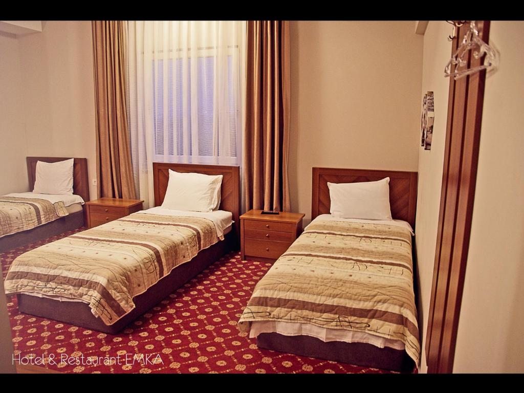 Postel nebo postele na pokoji v ubytování Hotel Emka