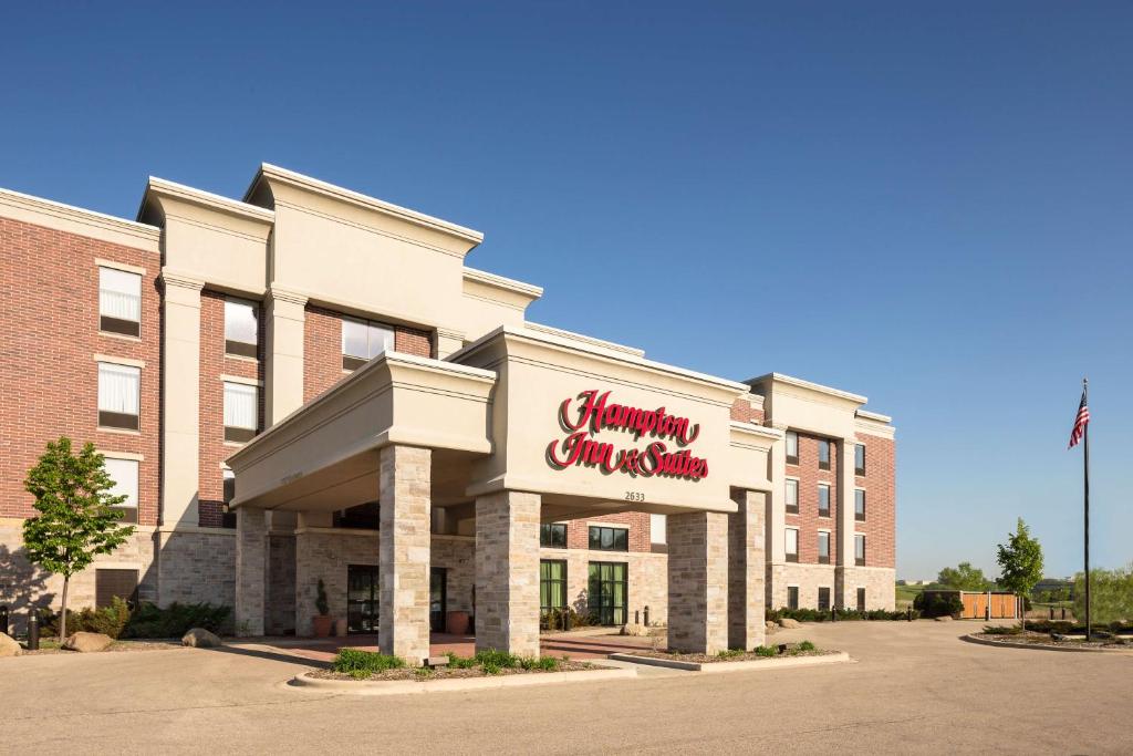 a hotel with a sign on the front of it at Hampton Inn & Suites Grafton in Grafton