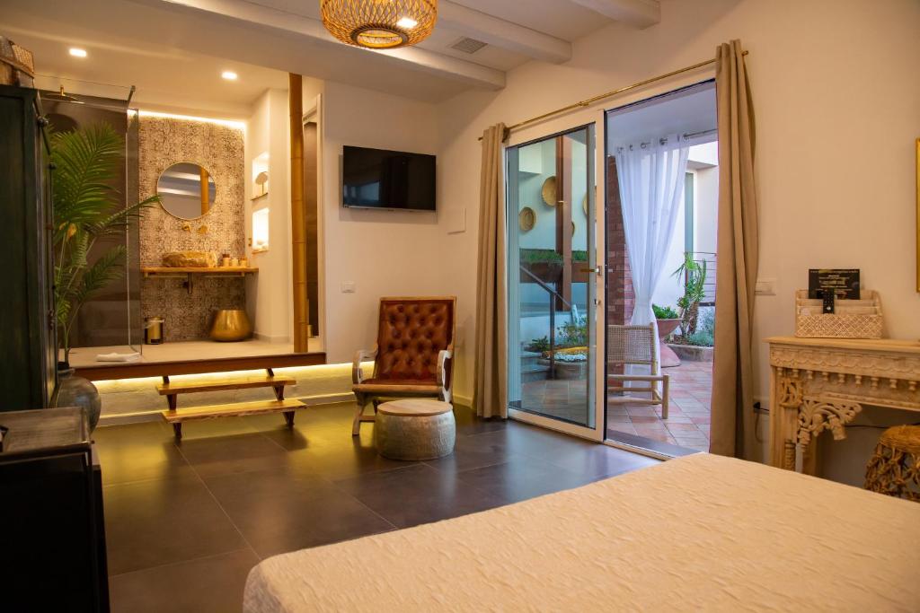 TV a/nebo společenská místnost v ubytování Amelia Apts & Rooms