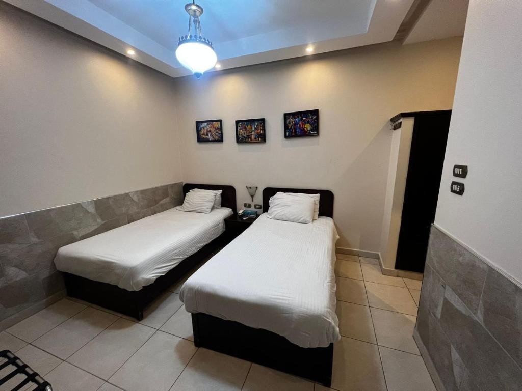 Postel nebo postele na pokoji v ubytování Salome Hotel