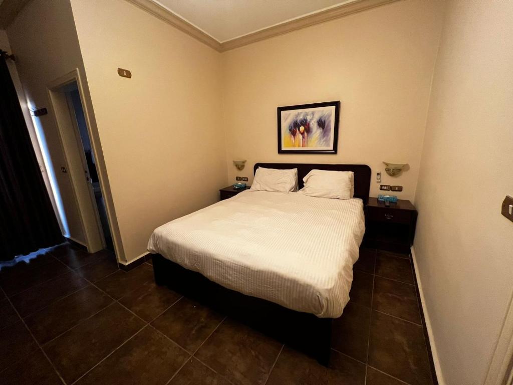 Postel nebo postele na pokoji v ubytování Salome Hotel