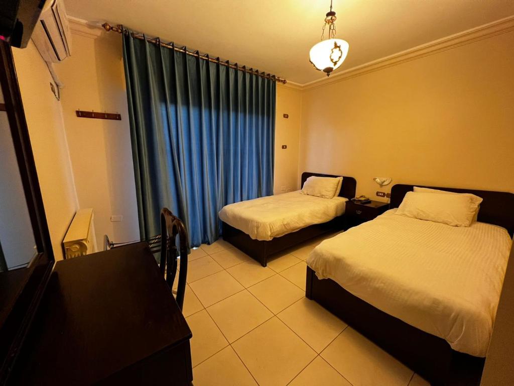 Postel nebo postele na pokoji v ubytování Salome Hotel