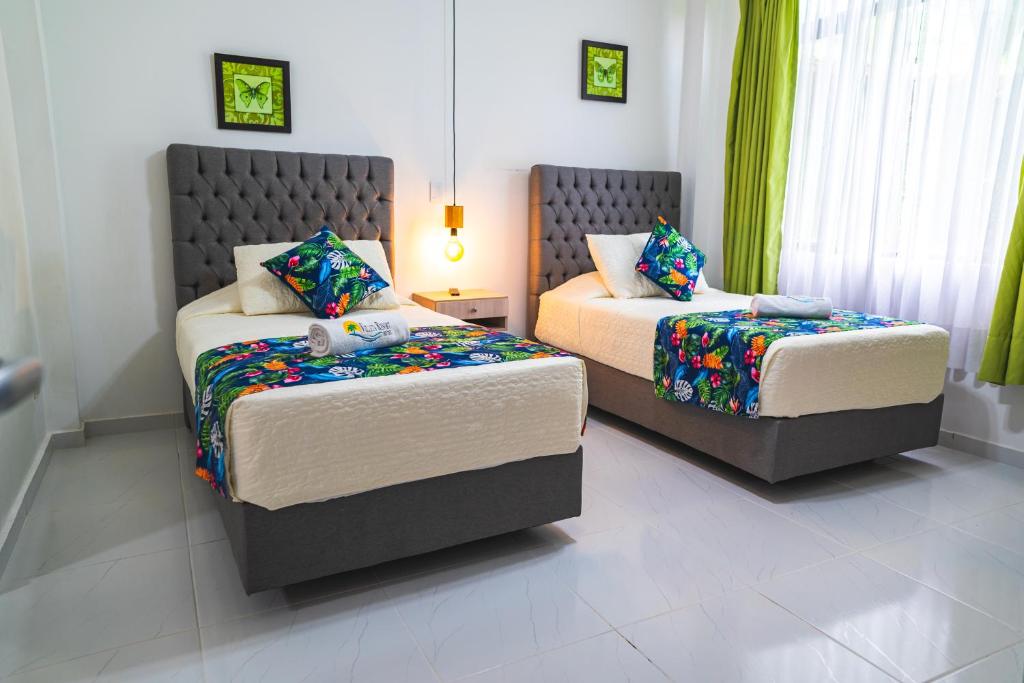 Postel nebo postele na pokoji v ubytování Villeta Resort Hotel