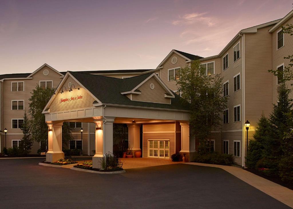 a building with a garage in front of it at Hampton Inn & Suites North Conway in North Conway