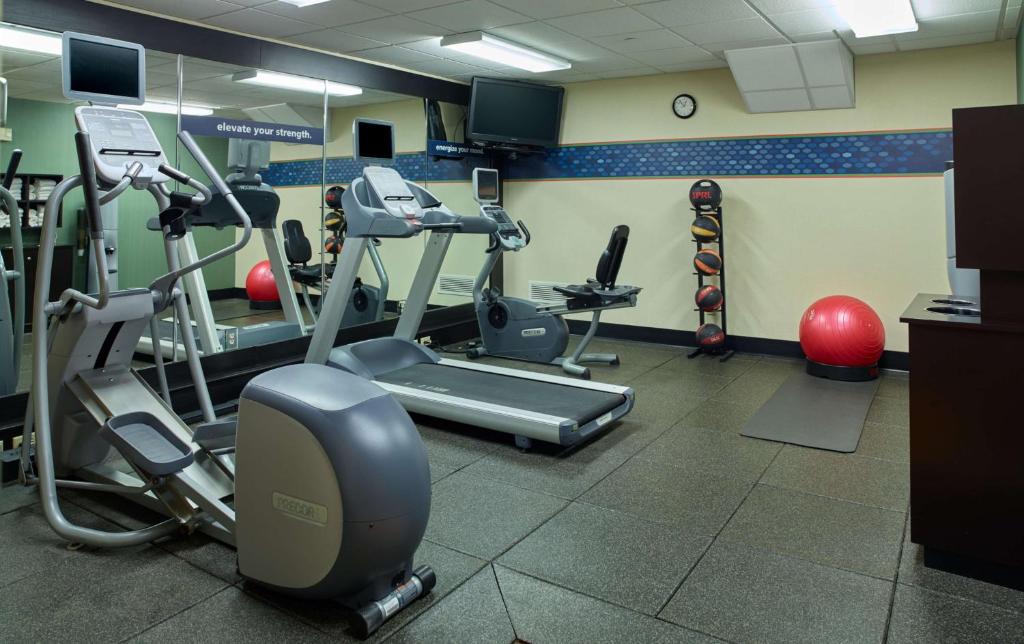 a gym with treadmills and machines in a room at Hampton Inn & Suites North Conway in North Conway