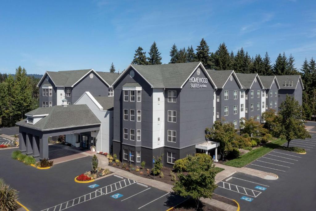 an aerial view of a hotel with a parking lot at Homewood Suites Hillsboro Beaverton in Beaverton