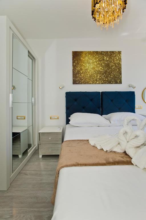 Łóżko lub łóżka w pokoju w obiekcie Luxury Apartment Veronika