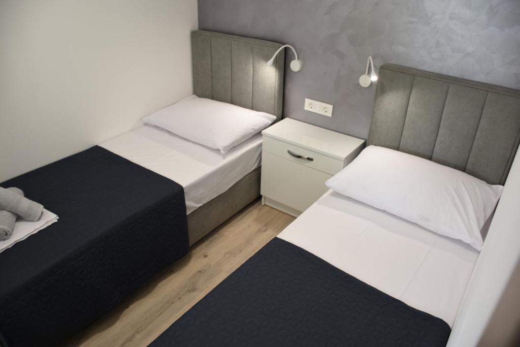 Postel nebo postele na pokoji v ubytování Mobile home Pelješac, Camp Vala