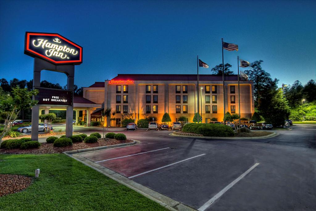 a hotel with a sign in a parking lot at Hampton Inn Rocky Mount in Rocky Mount