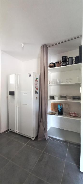 Kuchyň nebo kuchyňský kout v ubytování Villa Pomme cannelle
