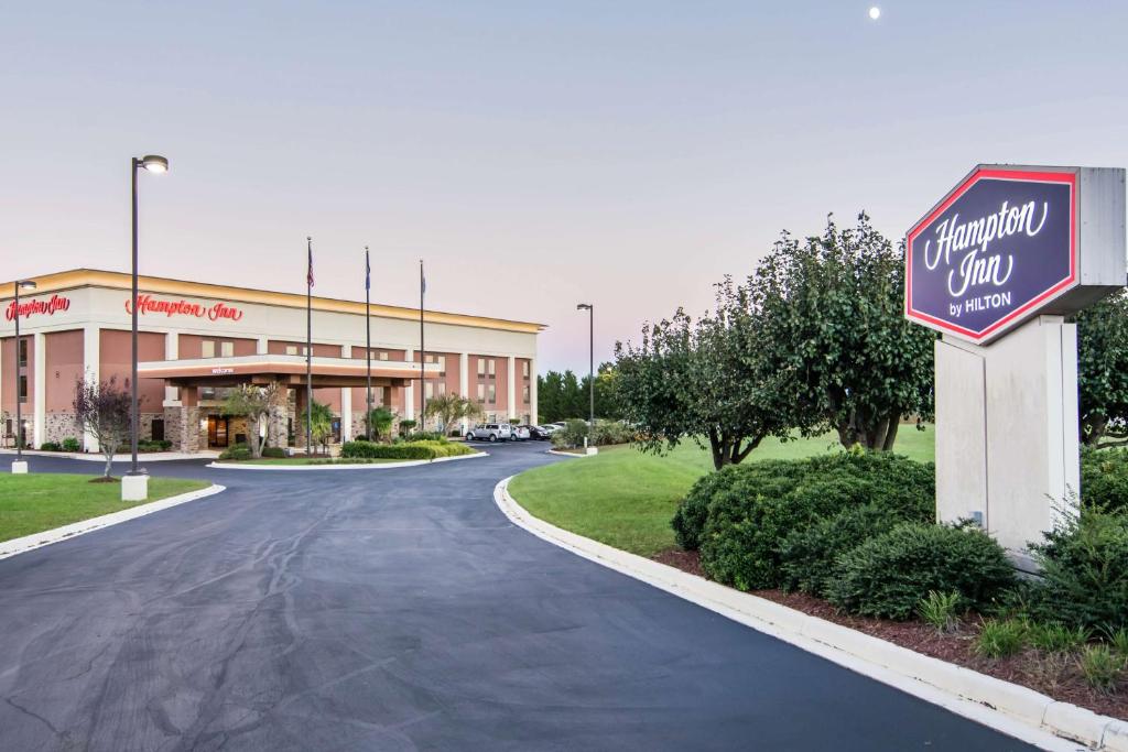 a sign for a shopping mall in front of a building at Hampton Inn South Hill in South Hill