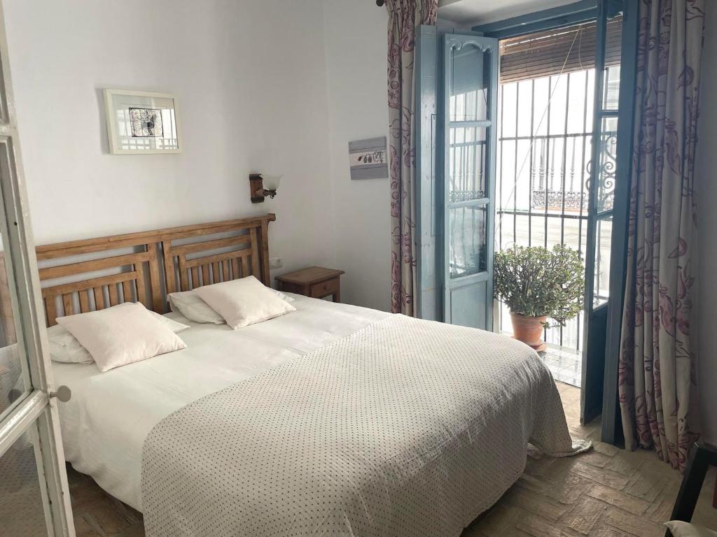 Posteľ alebo postele v izbe v ubytovaní Casa Badillo - Califa Casas Vejer
