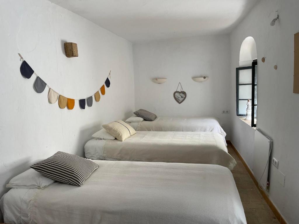 Posteľ alebo postele v izbe v ubytovaní Casa Badillo - Califa Casas Vejer