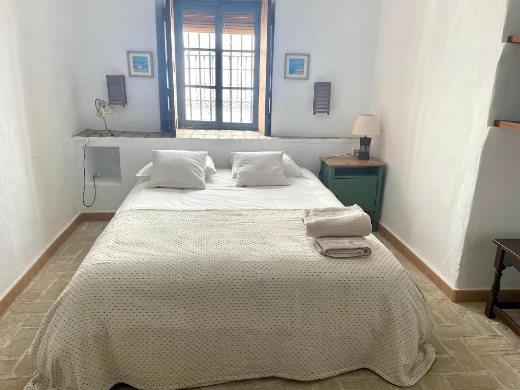 Posteľ alebo postele v izbe v ubytovaní Casa Badillo - Califa Casas Vejer