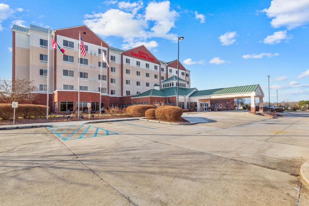 an empty parking lot in front of a hotel at Hilton Garden Inn Starkville in Starkville