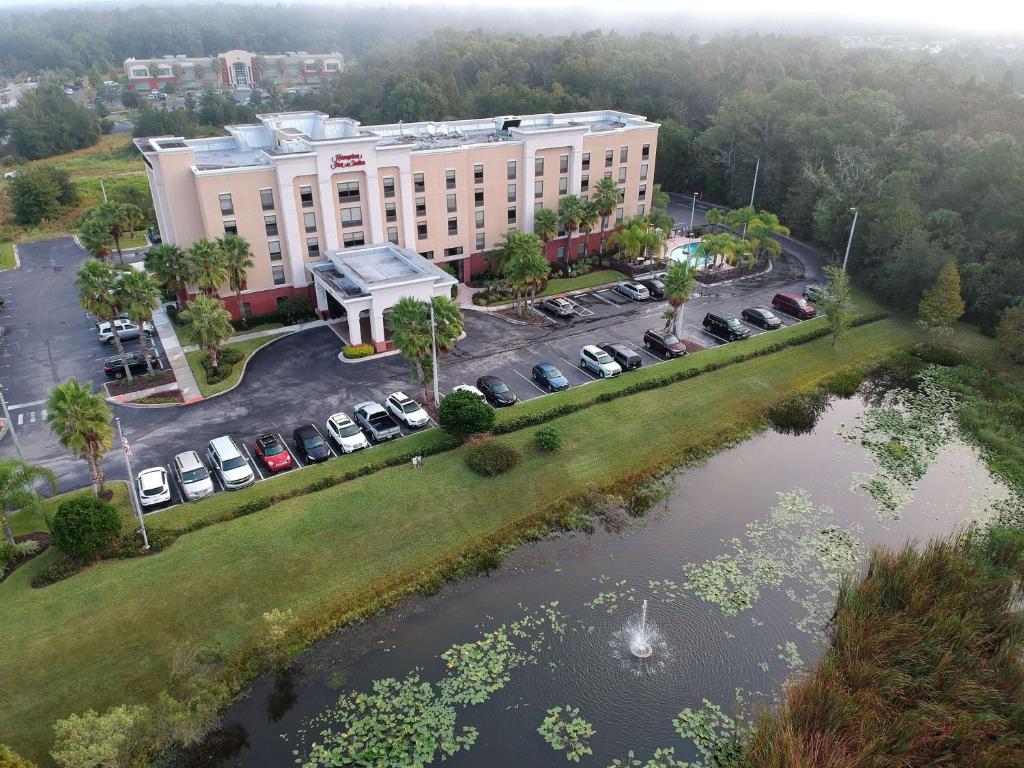 an aerial view of a hotel with a parking lot at Hampton Inn & Suites Tampa-Wesley Chapel in Wesley Chapel