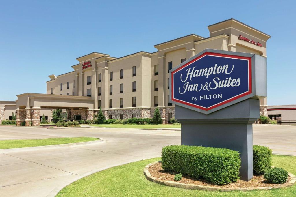 a sign for a hampton inn and suites at Hampton Inn & Suites Enid in Enid