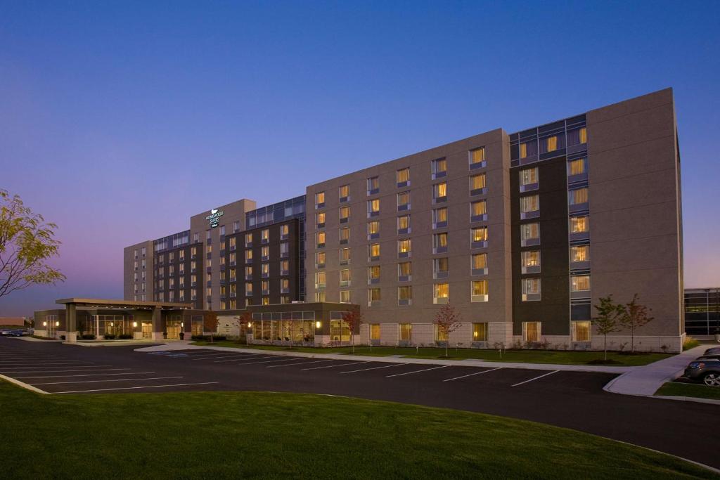 a rendering of a building with a parking lot at Homewood Suites by Hilton Toronto Vaughan in Vaughan