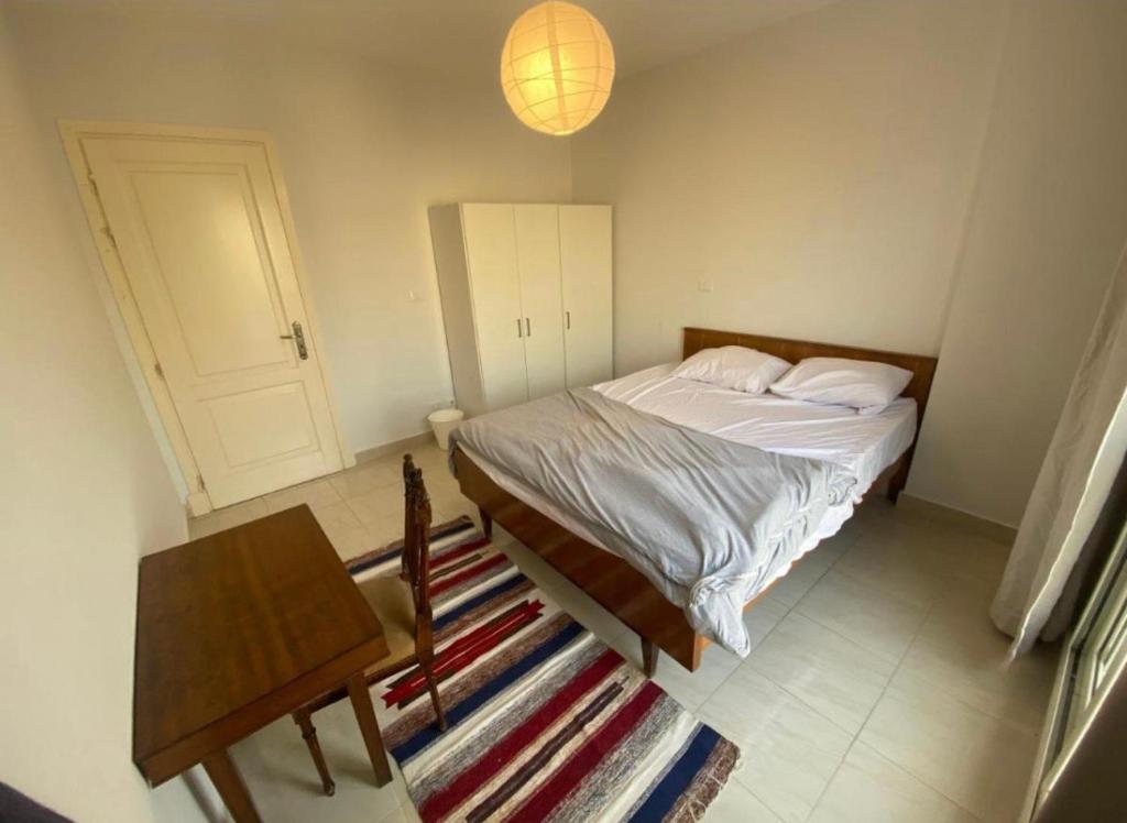 Postel nebo postele na pokoji v ubytování Madinaty Hotel