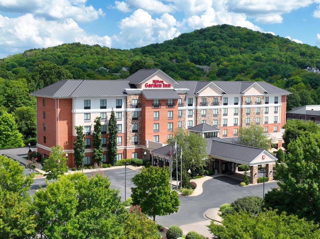 an image of a hotel with a mountain in the background at Hilton Garden Inn Nashville/Franklin-Cool Springs in Franklin