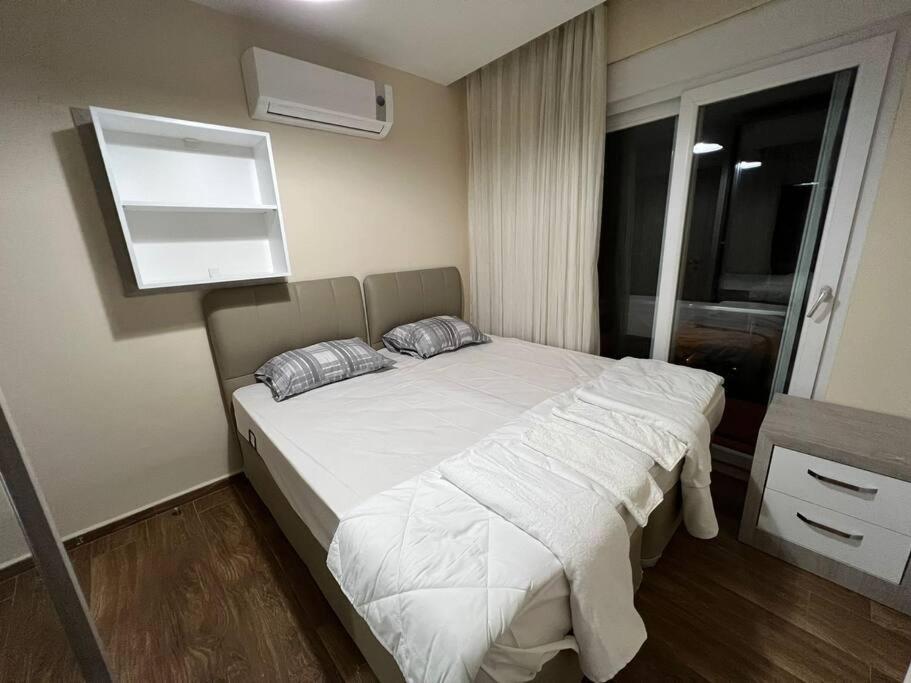 Postel nebo postele na pokoji v ubytování Ferah, Konyaaltı kumsalına yakın, merkezi konum '15'