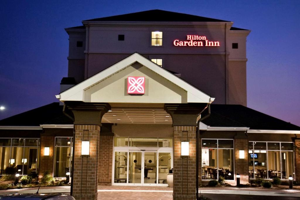 a hotel garden inn building with a sign on it at Hilton Garden Inn Aberdeen in Aberdeen