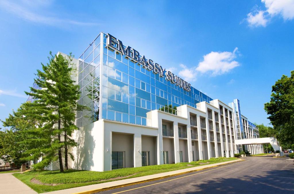 a building with a sign on the side of it at Embassy Suites by Hilton Cincinnati Northeast - Blue Ash in Blue Ash