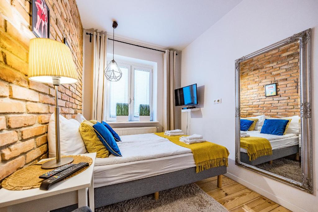 Postel nebo postele na pokoji v ubytování Pomorskie Apartamenty Enter House