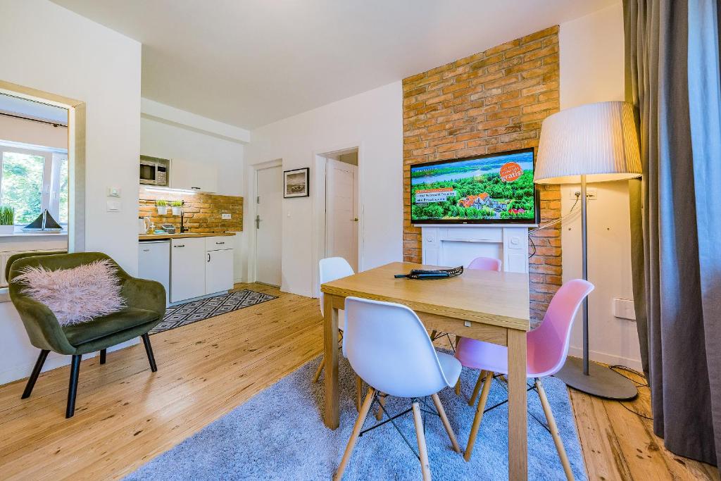 TV a/nebo společenská místnost v ubytování Pomorskie Apartamenty Enter House