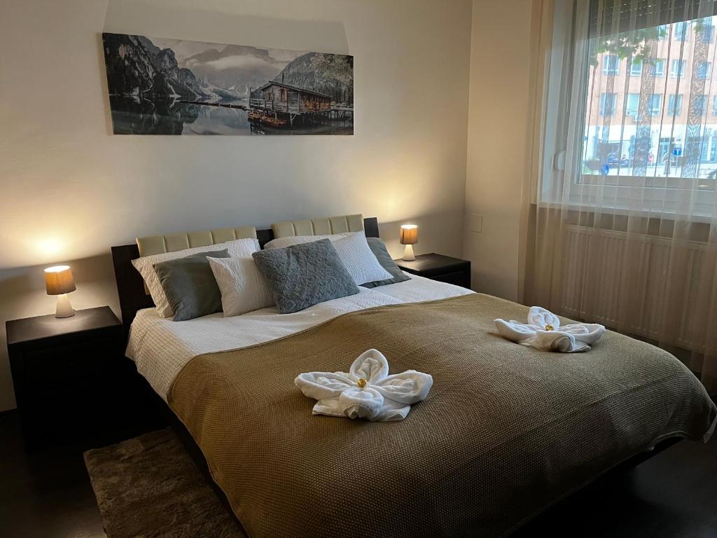 Postel nebo postele na pokoji v ubytování Borisz Apartman