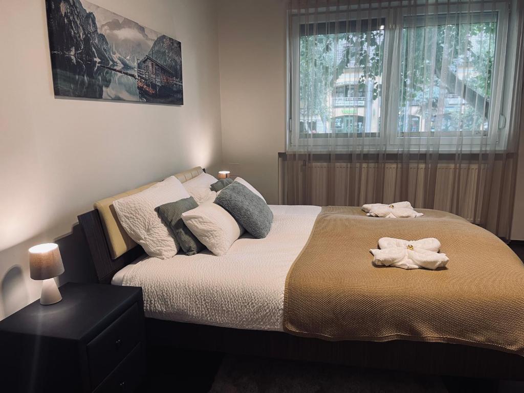 Postel nebo postele na pokoji v ubytování Borisz Apartman